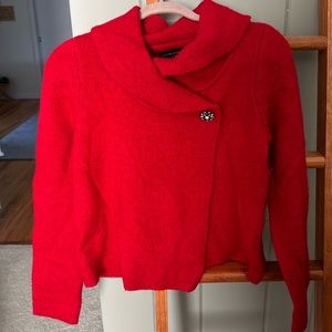 Red sweater with brooch